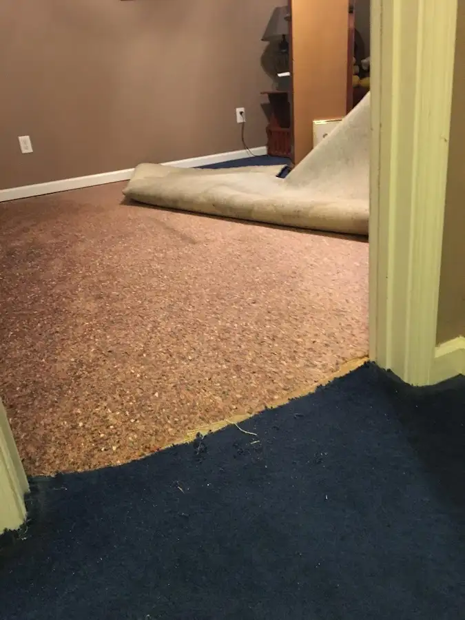 Carpet pad removal revealing water damage during Drying & Dehumidification in Town of Pecos